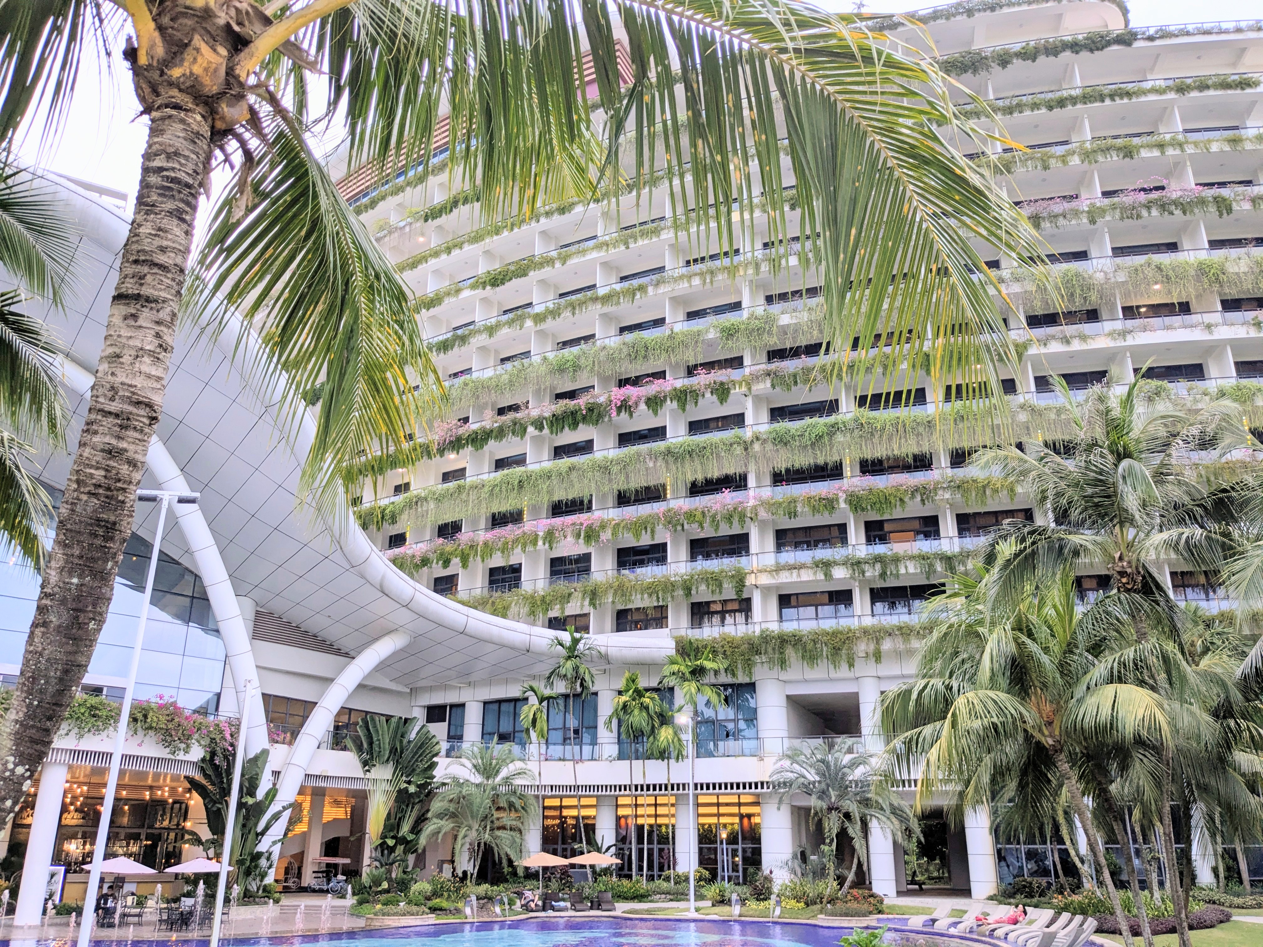 Forest City Marina Hotel exterior with palm trees
